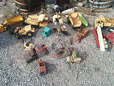 Old, rusted vintage toy vehicles on the ground Stock Photo