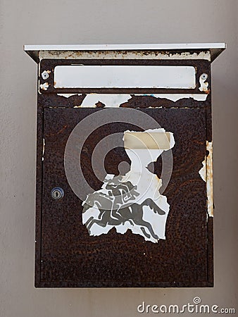Old, rusted, weathered mailboxes, on a house wall in Portugal Stock Photo