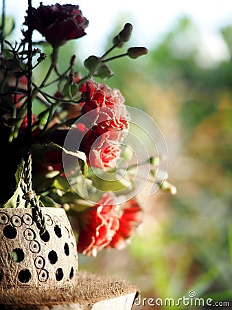 Old rustic abandoned decorative hanging hand crafted vase Stock Photo