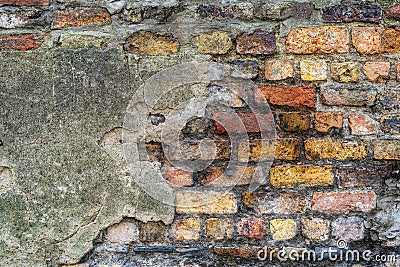 Old rustic brick wall with bits of grey plaster - high quality texture / background Stock Photo