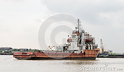 Old rustic construction ship on river Stock Photo