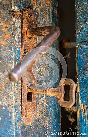 Old rustic door open with rusty lock, key and keyhole Stock Photo