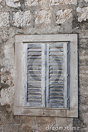 Old rustic painted window shades Stock Photo