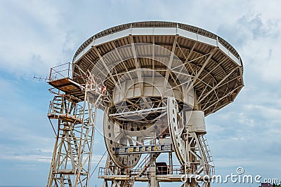 Old rusty abandoned radio telescope satellite dish Stock Photo