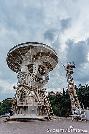 Old rusty abandoned radio telescope satellite dish Stock Photo