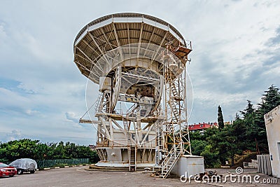 Old rusty abandoned radio telescope satellite dish Stock Photo