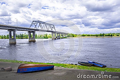 Old rusty boats thrown on shore of Pripyat river. Stock Photo