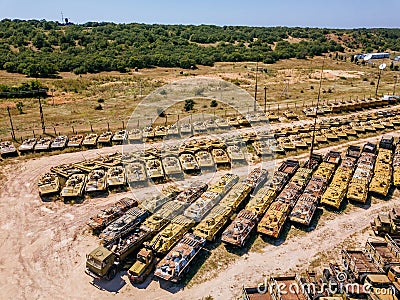 Old rusty broken Russian military vehicles in industrial area, aerial view Stock Photo