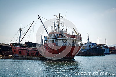 Old, rusty, cargo vessels at a ship-breaker. Stock Photo