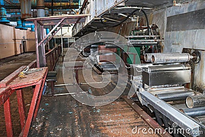 Old rusty closed peeling shop at a abandoned industrial obsolete chemical petrochemical engineering refinery with metal iron pipes Stock Photo