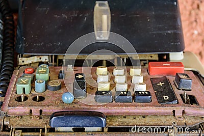 Old, rusty and damaged mechanical calculating machine Stock Photo