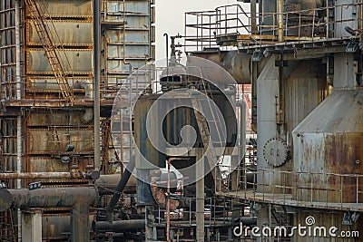 Old rusty factory metal structures with pipes. Stock Photo