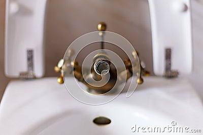 Old rusty faucet aerator with lime spots, Stock Photo