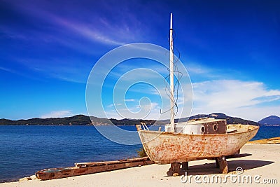 An old rusty fishing boat in the village of Petriti, Corfu Stock Photo