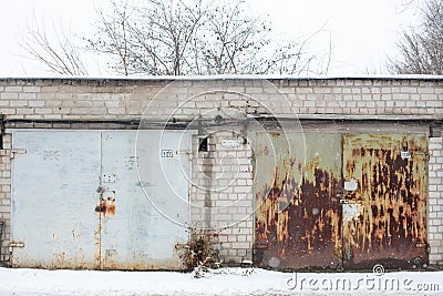 Old rusty garages in the CIS countries in the winter Stock Photo
