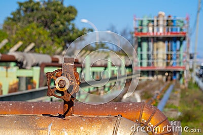 old and rusty industrial liquid control faucet. Stock Photo