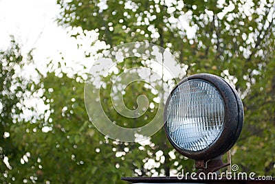 Old rusty lantern headlight tractor, agricultural machinery, excavator Stock Photo