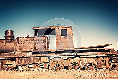 Old rusty locomotive abandoned in the train cemetery of Uyuni Bolivia Stock Photo