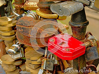 Rusty love locks found on the balustrade of a bridge in Riga Editorial Stock Photo