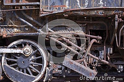 Old rusty iron wheels and pipes on an antique steam engine Stock Photo