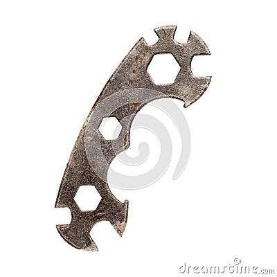 Old rusty multi function bicycle wrench hexagon. Stock Photo