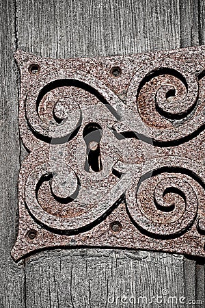 Old rusty ornate metal keyhole Stock Photo