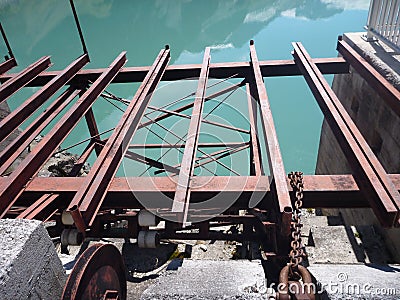 Old rusty red dam elevator steel structure Stock Photo