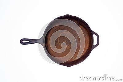 Old rusty round cast iron frying pan Stock Photo