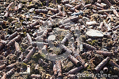 Old rusty shell bullets scattered on the ground Stock Photo