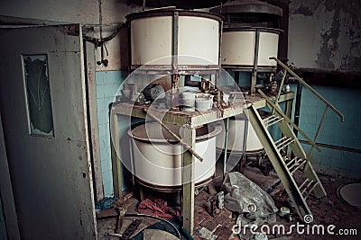 Old rusty small vats in abandoned chemical factory Stock Photo