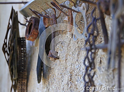 Old rusty tool on an old hanger hook Stock Photo