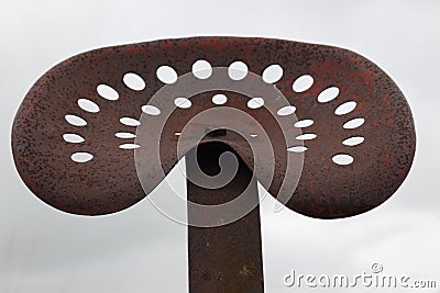 Old rusty tractor seat Stock Photo