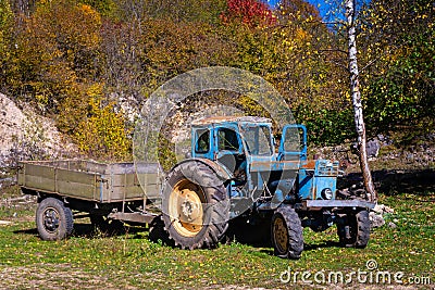 Old Rusty Tractor still working Stock Photo