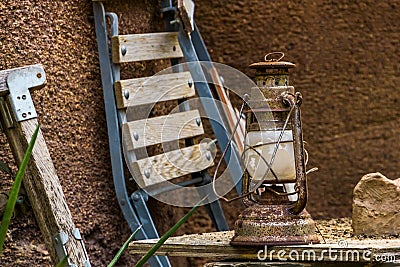 Old Rusty vintage lantern, basic indoor and outdoor lighting, Nostalgic camping equipment Stock Photo