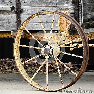 Old Rusty Wagon Wheel on Wooden Wagon Stock Photo