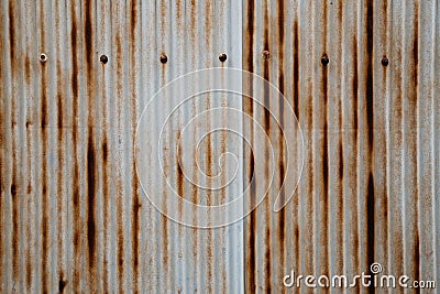 Old rusty wavy metal plate wall Stock Photo