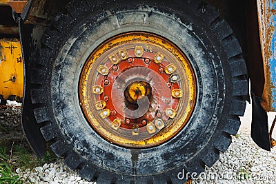 Old rusty wheel of haul truck Stock Photo