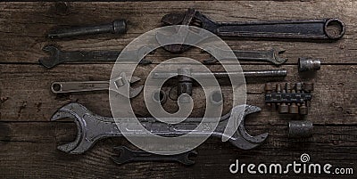 Old rusty wrenches on a wood table, top view Stock Photo