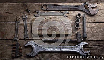 Old rusty wrenches on a wood table, top view Stock Photo