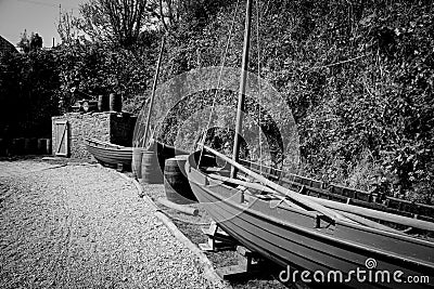 Old Sailing Lugger canons and barrels in Historic Port of Charlestown Stock Photo