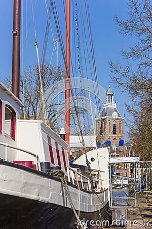 Old sailing ship and church tower in Meppel Stock Photo