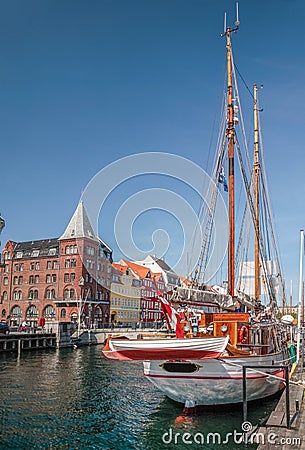 Old sailing ships and houses in Nyhavn in Copenhagen Editorial Stock Photo