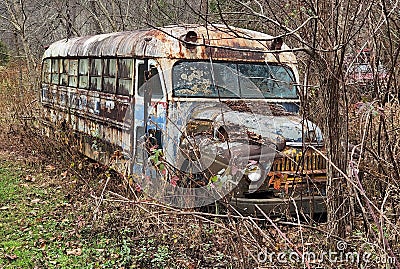 Old School Bus Rusting Away Stock Photo