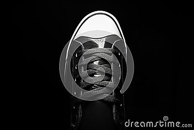 Old school fashion sport shoe. Close-up of vintage sneaker shoe. Black and white photo. Stock Photo