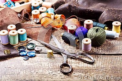 Old scissors, various threads and sewing tools Stock Photo