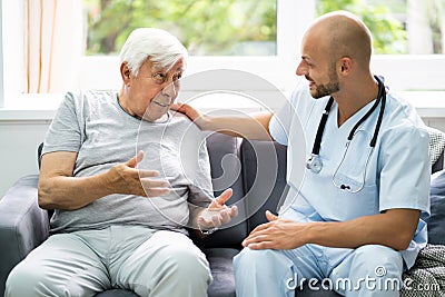 Old Senior Home Care Patient With Nurse Stock Photo