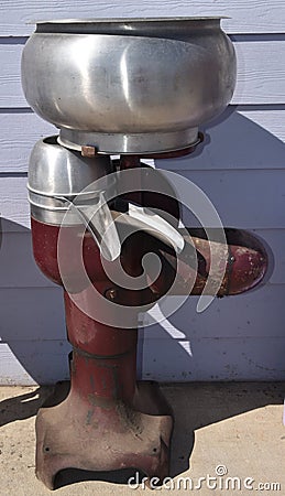 An old cream separator for removing cream from milk Stock Photo