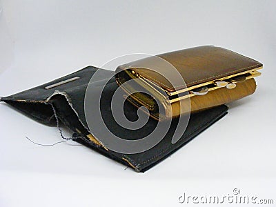 Old shabby empty wallet with elegant golden wallet with monney Stock Photo