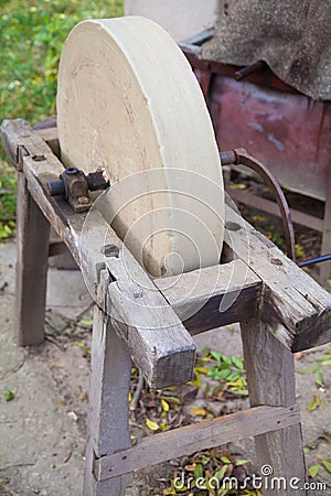 Old sharpening stone wheel Stock Photo