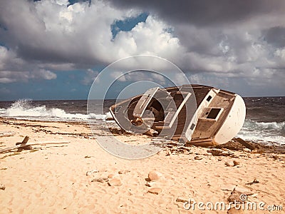 Old ship wreck, stranded boat on beach - vintage style - Stock Photo